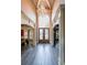 Grand foyer with a soaring ceiling, beautiful chandelier, arched doorway, and hardwood floors at 1391 Harris Rd, Lawrenceville, GA 30043