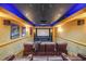 Home theater room features a projector, comfortable seating, and custom lighting at 1391 Harris Rd, Lawrenceville, GA 30043
