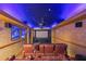 Home theater room features a projector, comfortable seating, and custom lighting at 1391 Harris Rd, Lawrenceville, GA 30043