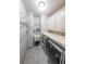 Functional laundry room with washer, dryer, sink, storage shelves, and built in cabinets at 1391 Harris Rd, Lawrenceville, GA 30043