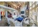 Bright living room with large windows, fireplace, two-story ceiling, and hardwood floors at 1391 Harris Rd, Lawrenceville, GA 30043