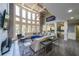 Bright living room with large windows, fireplace, open layout, and sleek gray walls at 1391 Harris Rd, Lawrenceville, GA 30043