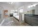 Main bathroom featuring dual sinks, a soaking tub, walk-in shower and granite counters at 1391 Harris Rd, Lawrenceville, GA 30043