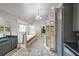 Beautiful main bathroom with dual sinks, granite counters, walk-in shower, vaulted ceiling, and soaking tub at 1391 Harris Rd, Lawrenceville, GA 30043