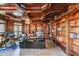 Wood-paneled office with built-in bookshelves, hardwood floors, and ceiling fan at 1391 Harris Rd, Lawrenceville, GA 30043