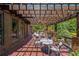 Relaxing covered patio with comfortable seating and string lights, perfect for outdoor gatherings at 1391 Harris Rd, Lawrenceville, GA 30043
