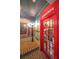 Themed phone booth entrance with classic posters, brick details, and a British phone at 1391 Harris Rd, Lawrenceville, GA 30043