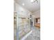 Gorgeous walk-in shower with multiple shower heads, tiled walls, and glass door enclosure at 1391 Harris Rd, Lawrenceville, GA 30043