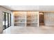 Basement featuring stone wall accents, shelving units and recessed lights at 1718 Barnesdale Ne Way, Atlanta, GA 30309