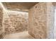 Unfinished basement featuring stone wall and a concrete floor at 1718 Barnesdale Ne Way, Atlanta, GA 30309