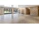 Expansive basement with stone walls, built-in shelving, and bright lighting at 1718 Barnesdale Ne Way, Atlanta, GA 30309