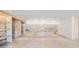 Partially finished basement with stone wall accent lighting and concrete floors at 1718 Barnesdale Ne Way, Atlanta, GA 30309