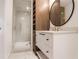 Bathroom featuring a walk-in shower with marble tile and glass door at 1718 Barnesdale Ne Way, Atlanta, GA 30309