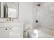 Bright bathroom featuring a shower and vanity with modern fixtures and finishes at 1718 Barnesdale Ne Way, Atlanta, GA 30309