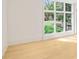 Bedroom with hardwood floors and large windows with green views at 1718 Barnesdale Ne Way, Atlanta, GA 30309