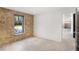 Bedroom featuring a stone accent wall and entryway to basement at 1718 Barnesdale Ne Way, Atlanta, GA 30309