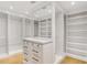 Custom walk-in closet with built-in shelving, drawers, and a vanity area at 1718 Barnesdale Ne Way, Atlanta, GA 30309