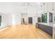 Bright, open kitchen area with a large island, modern lighting, and hardwood flooring at 1718 Barnesdale Ne Way, Atlanta, GA 30309