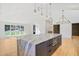 Open-concept kitchen with a large marble island, pendant lighting, and stainless steel appliances at 1718 Barnesdale Ne Way, Atlanta, GA 30309