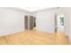 Spacious room with hardwood floors, neutral paint, and doorways to adjacent rooms at 1718 Barnesdale Ne Way, Atlanta, GA 30309