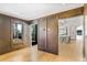 Elegant room showcasing wood paneled walls, hardwood floors, and view into the modern kitchen at 1718 Barnesdale Ne Way, Atlanta, GA 30309