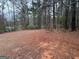 An expansive lot with mature trees creating a private, backyard setting at 213 Sharon Drive, Canton, GA 30115