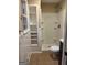 Clean bathroom with a shower and built-in shelving at 213 Sharon Drive, Canton, GA 30115