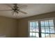 Comfortable bedroom featuring a ceiling fan and a large window at 213 Sharon Drive, Canton, GA 30115