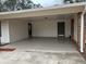 Spacious carport with concrete flooring and two convenient entry doors to the house at 213 Sharon Drive, Canton, GA 30115