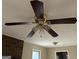 A traditional ceiling fan with lights fixture mounted on the ceiling at 213 Sharon Drive, Canton, GA 30115