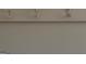 White coat rack attached to a neutral-toned wall, offering a practical and tidy storage solution at 213 Sharon Drive, Canton, GA 30115