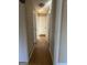 Neutral-toned hallway with wood floors, multiple doorways, and a clean, streamlined design at 213 Sharon Drive, Canton, GA 30115