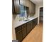 Bright kitchen with wood cabinets, white countertops and stainless-steel appliances at 213 Sharon Drive, Canton, GA 30115