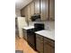 Functional kitchen featuring ample counter space, cabinets, and modern black appliances at 213 Sharon Drive, Canton, GA 30115