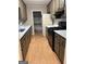 Functional kitchen featuring ample counter space, cabinets, and a walk-in pantry at 213 Sharon Drive, Canton, GA 30115