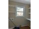 Functional laundry room with shelving and window at 213 Sharon Drive, Canton, GA 30115