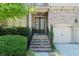 Welcoming front entrance with brick steps, a double door, and manicured bushes at 4022 Newhaven Ne Cir, Brookhaven, GA 30319
