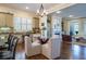 Bright kitchen, island seating, built-in desk, and an open view to the living room at 4022 Newhaven Ne Cir, Brookhaven, GA 30319