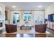 Light filled living room with French doors, fireplace, built-ins, hardwood floors, and a neutral color palette at 4022 Newhaven Ne Cir, Brookhaven, GA 30319