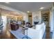 Spacious living room boasts hardwood floors, fireplace with built-ins, and an open layout to the kitchen at 4022 Newhaven Ne Cir, Brookhaven, GA 30319