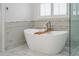 Spa-like bathroom with soaking tub and separate glass shower, and natural light at 4022 Newhaven Ne Cir, Brookhaven, GA 30319