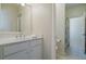 Bright bathroom featuring a white vanity, large mirror, and shower with curtain at 4022 Newhaven Ne Cir, Brookhaven, GA 30319