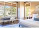 Bright bedroom with large windows, hardwood floors, and a cozy bench at 4022 Newhaven Ne Cir, Brookhaven, GA 30319