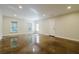 Spacious bonus room with polished concrete floors, neutral walls, and natural light from the windows at 4022 Newhaven Ne Cir, Brookhaven, GA 30319