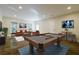 Well-lit bonus room with a pool table and tastefully designed seating area at 4022 Newhaven Ne Cir, Brookhaven, GA 30319