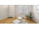 Bright foyer with hardwood flooring, white walls, a window with views, and indoor greenery at 1926 Regency Cove Ct, Atlanta, GA 30341