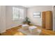 Versatile flex room with hardwood flooring, white walls, natural light, and peaceful plants at 1926 Regency Cove Ct, Atlanta, GA 30341