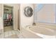 Lovely bathroom with a garden tub and a walk-in closet at 1926 Regency Cove Ct, Atlanta, GA 30341