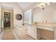 Bright main bathroom with a soaking tub, tiled floor, and walk-in closet access at 1926 Regency Cove Ct, Atlanta, GA 30341