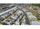 An aerial view of a neighborhood featuring townhomes with light exteriors and a community pool at 204 N Esplanade, Alpharetta, GA 30009